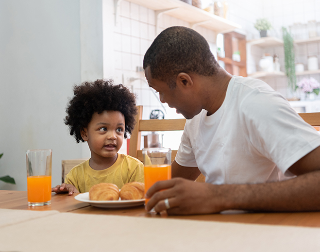 Father and child eating together